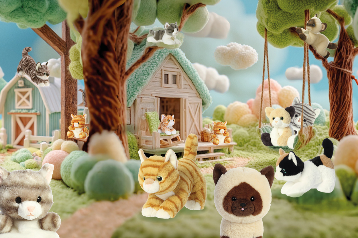 Kuscheltier-Szenario mit verschiedenen Katzenfiguren, die um eine kleine Scheune und Bäume angeordnet sind, umgeben von bunten Wolken und Bällen.