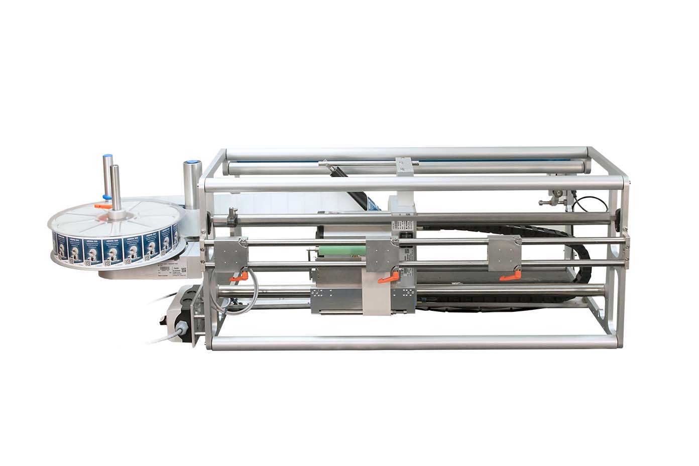 Eine mechanische Vorrichtung mit einem runden Behälter und einem Gestell, das für automatisierte Prozesse in der Industrie konzipiert ist.