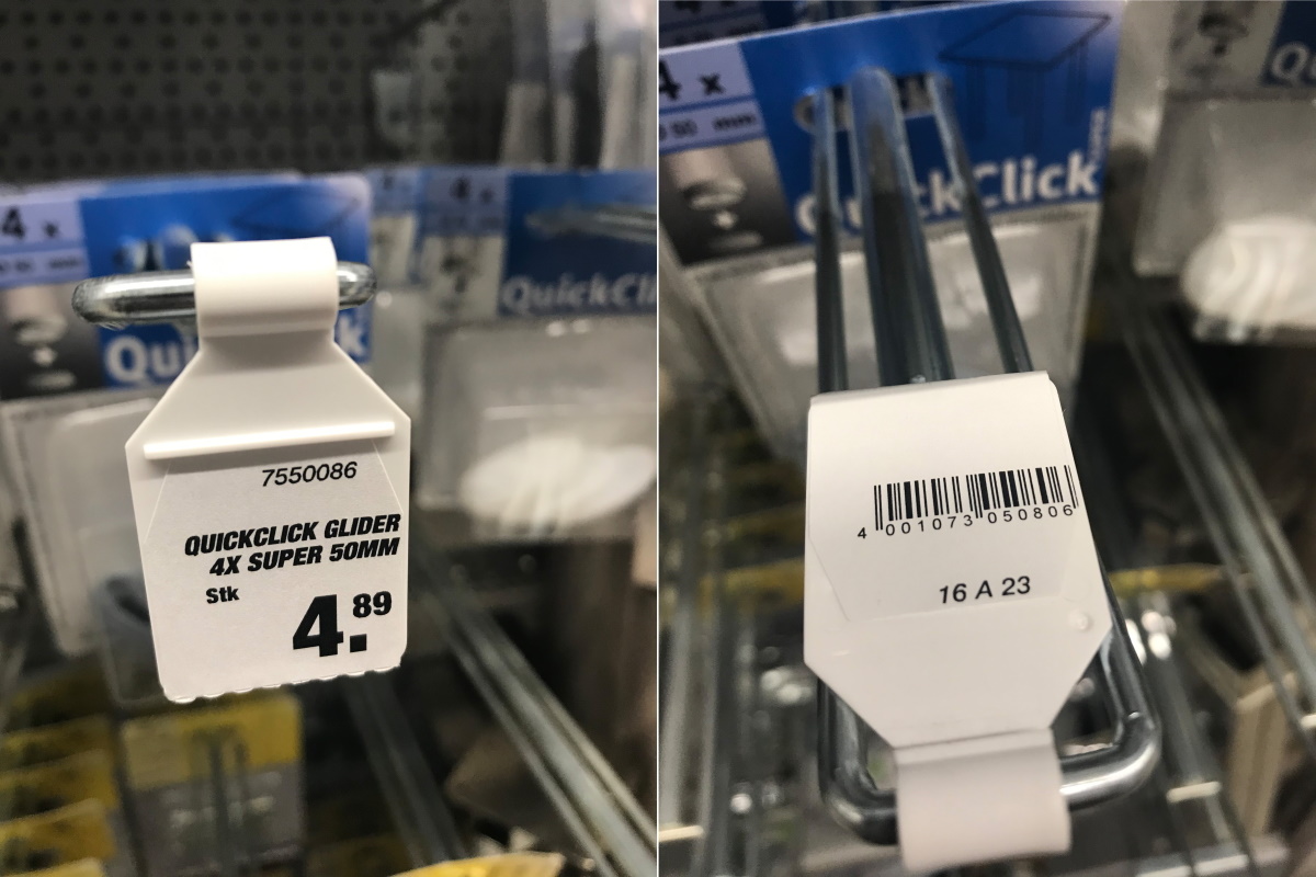 Lösungen Baustoffsektor: Klapphaken mit Etikettenfahne im Baumarkt, Vorder- und Rückseite
