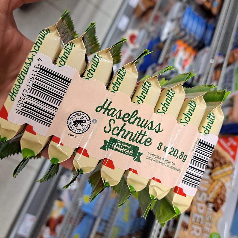 Lösungen Lebensmittel: Banderolenetikett mit Perforation, auf Nussriegel-Verpackung