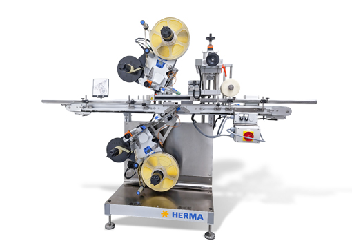 Automatische Etikettiermaschine mit zwei Etikettierköpfen, ausgestattet mit Rollen und Steuerungselementen, auf einem stabilen Gestell.