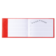 Ein rotes Notizbuch mit leeren Seiten und handgezeichneten Noten auf der linken Seite.