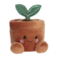 Kuscheltopf mit einem lächelnden Gesicht und zwei runden Armen, aus dem ein grünes Blatt wächst.