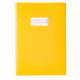 Gelbes Notizbuch mit einer weißen Etikette auf der Vorderseite, die Platz für Beschriftungen bietet.