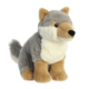 Plüschwolf mit grauem Fell und beigem Bauch, sitzt aufrecht mit einem freundlichen Gesichtsausdruck.