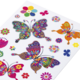 Bunte Aufkleber von Schmetterlingen und Blumen in verschiedenen Farben und Mustern auf weißem Hintergrund.