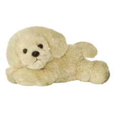 Ein liegendes, plüschiges Hundespielzeug in hellbeiger Farbe mit großen Augen und einem freundlichen Gesichtsausdruck.