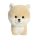 Plüschhund in Form eines Shiba Inu mit einem runden Kopf, großen Augen und einem freundlichen Ausdruck.