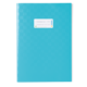Blaues Notizbuch mit strukturiertem Cover und einem weißen Etikett zum Beschriften.