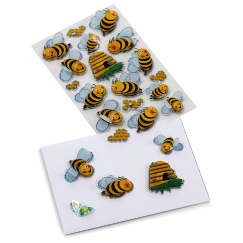 Bunte Aufkleber von Bienen und einem Bienenstock auf einem weißen Hintergrund, ideal für Bastelprojekte oder Dekoration.