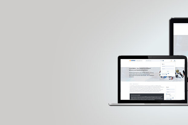 Verschiedene elektronische Geräte, darunter ein Desktop-Computer, ein Laptop, ein Tablet und ein Smartphone, zeigen eine Website.