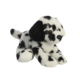 Plüschhund mit schwarz-weißen Flecken, in liegender Position, mit großen Augen und weichem Fell.