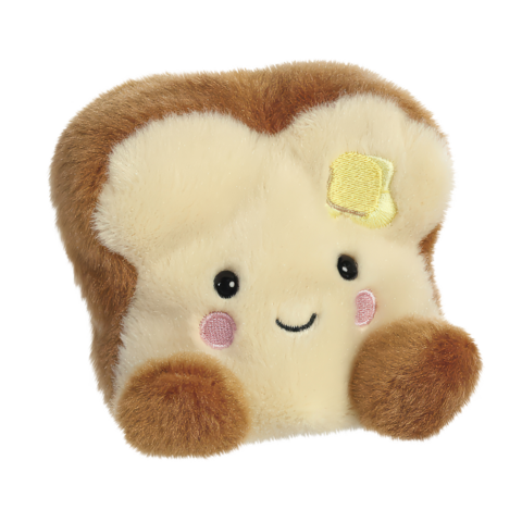 Kuscheliges Toastbrot mit einem lächelnden Gesicht und einem Stück Butter oben drauf.