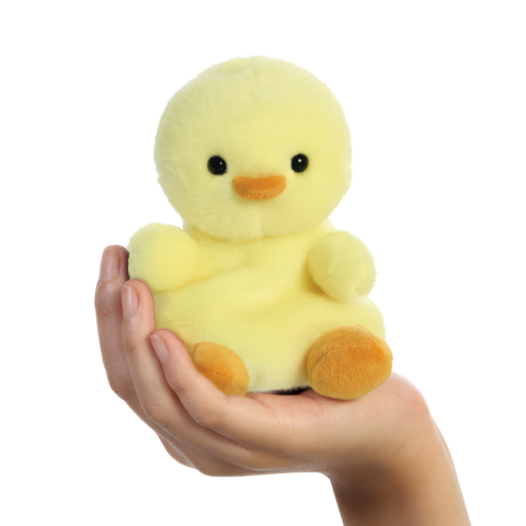 Eine Hand hält ein gelbes, plüschiges Entchen mit schwarzen Augen und einem orangefarbenen Schnabel.