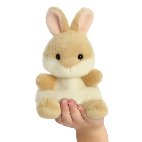 Ein Hand hält ein plüschiges Kaninchen mit großen Ohren und einem freundlichen Gesichtsausdruck.
