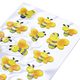 Bunte Aufkleber von Bienen und Käfern in Gelb und Schwarz auf einer glänzenden Folie.