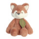 Kuscheltier in Form eines Fuchses mit braunem Fell und weißen Akzenten, trägt ein grünes Etikett.