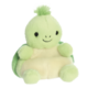 Grünes, kuscheliges Plüschtier in Form einer Schildkröte mit einem lächelnden Gesicht und einem kleinen Haarschopf.