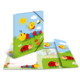 Bunt gestaltetes Notizbuch mit Käfern, Sonnen und Blumen auf dem Cover, geöffnet mit Innenseiten und einem kleinen Notizblock.